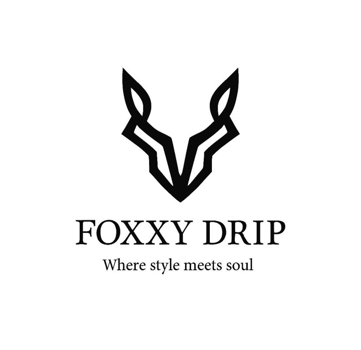 Stylish urban fashion model wearing Foxxy Drip streetwear collection with bold graphics and premium fabrics
